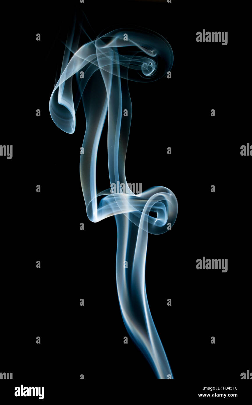 Abstract blue smoke isolated on black Stock Photo - Alamy
