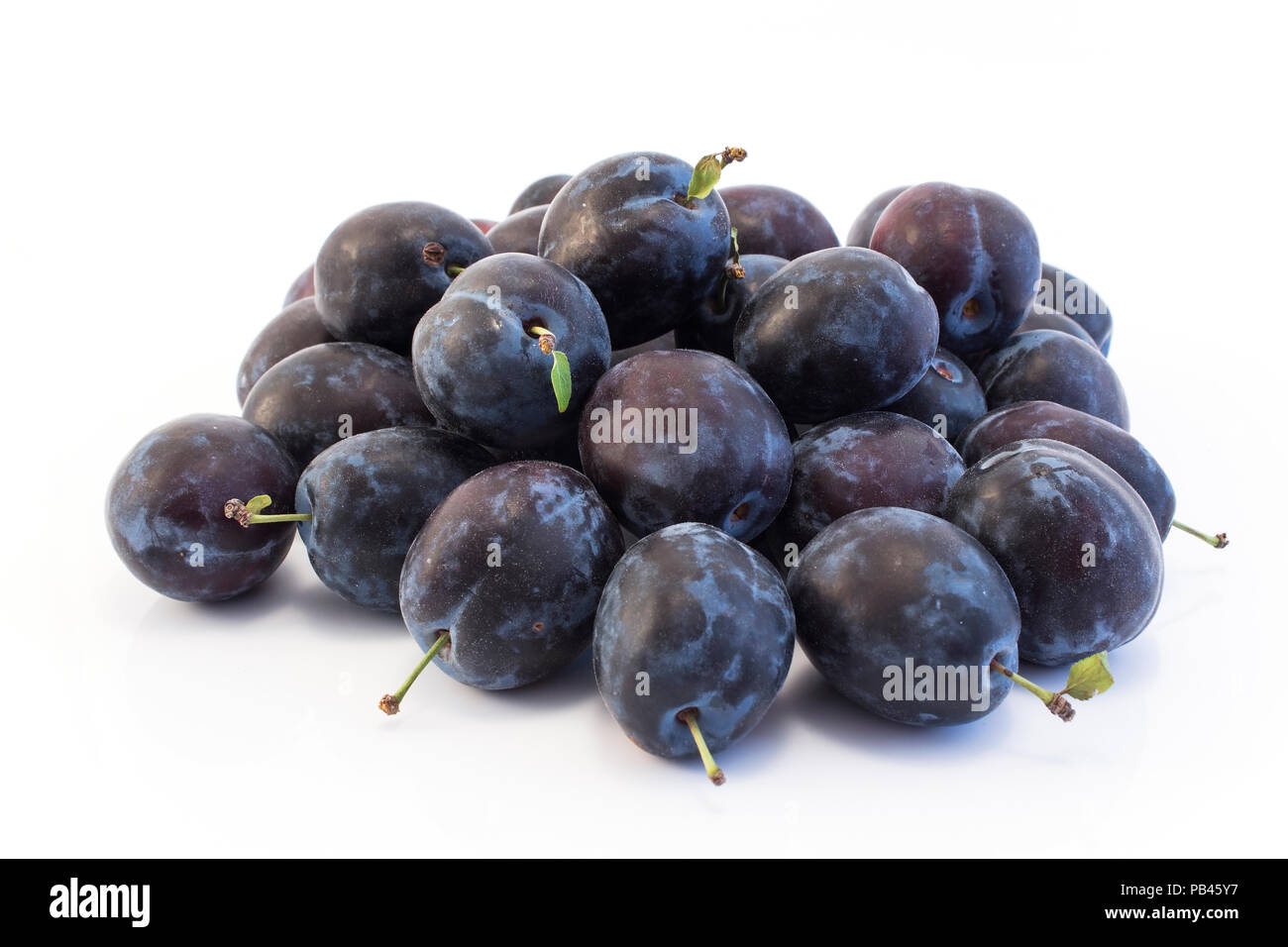 Ripe Plums Isolated on White. Stock Photo