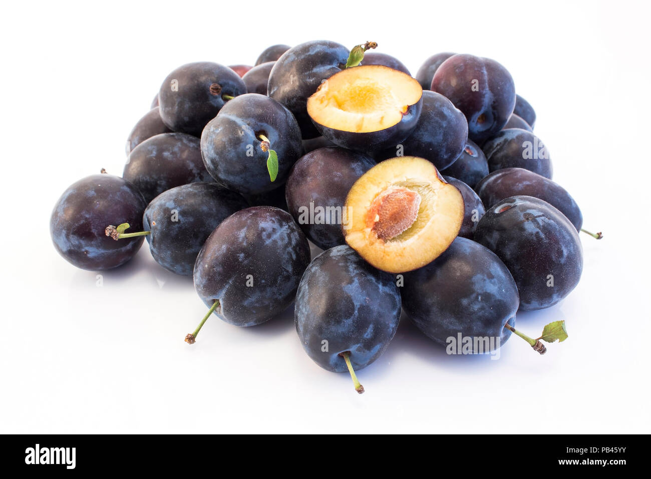 Ripe Plums Isolated on White. Stock Photo