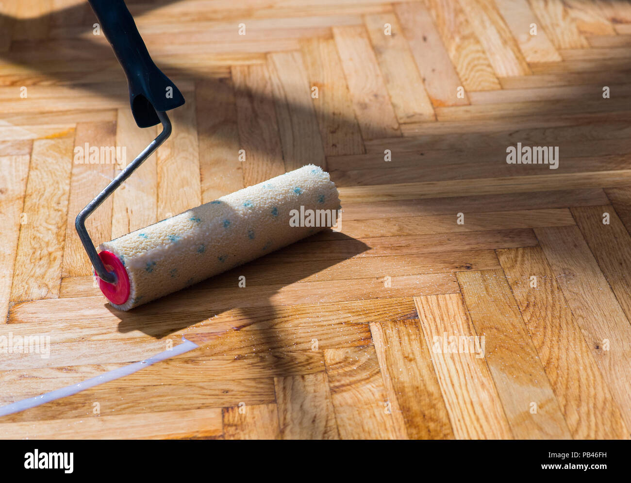 roller for floor varnish Stock Photo Alamy