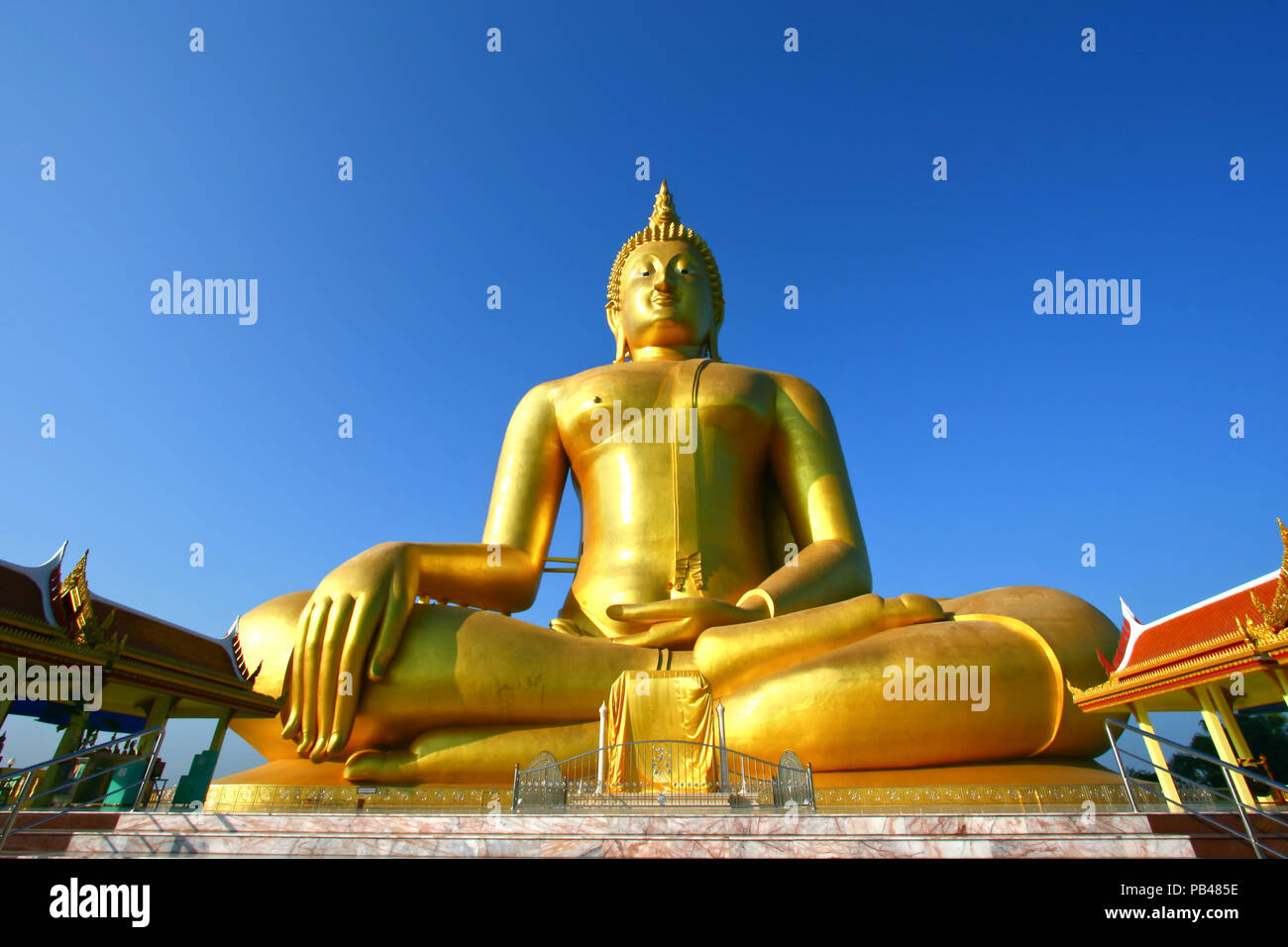 big golden Buddha statue with a blue sky, Thailand Stock Photo