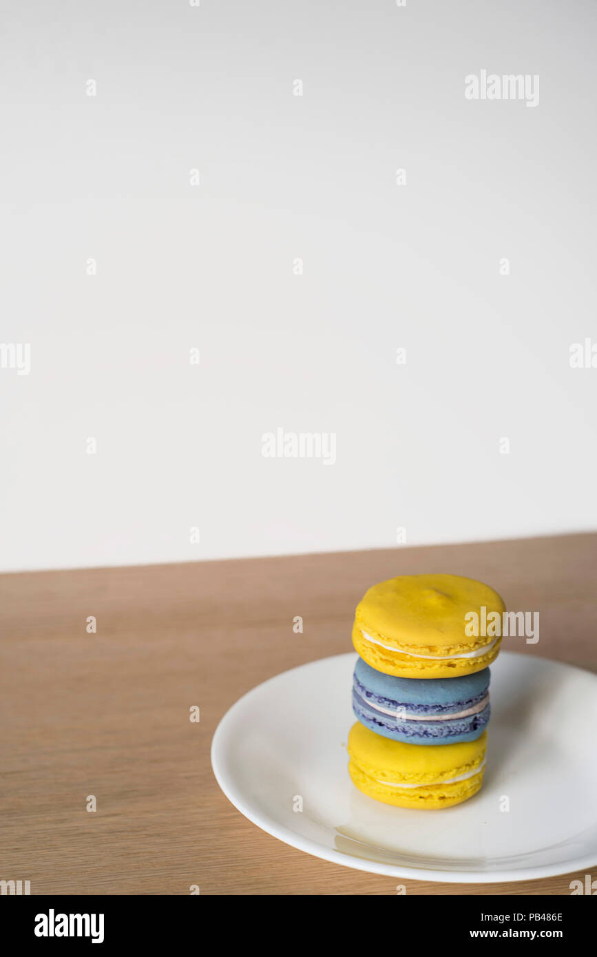 Yellow and Blue Macarons for a special treat Stock Photo
