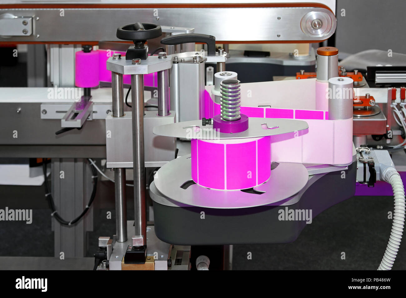 Automated labeling machine equipment with conveyor belt Stock Photo Alamy