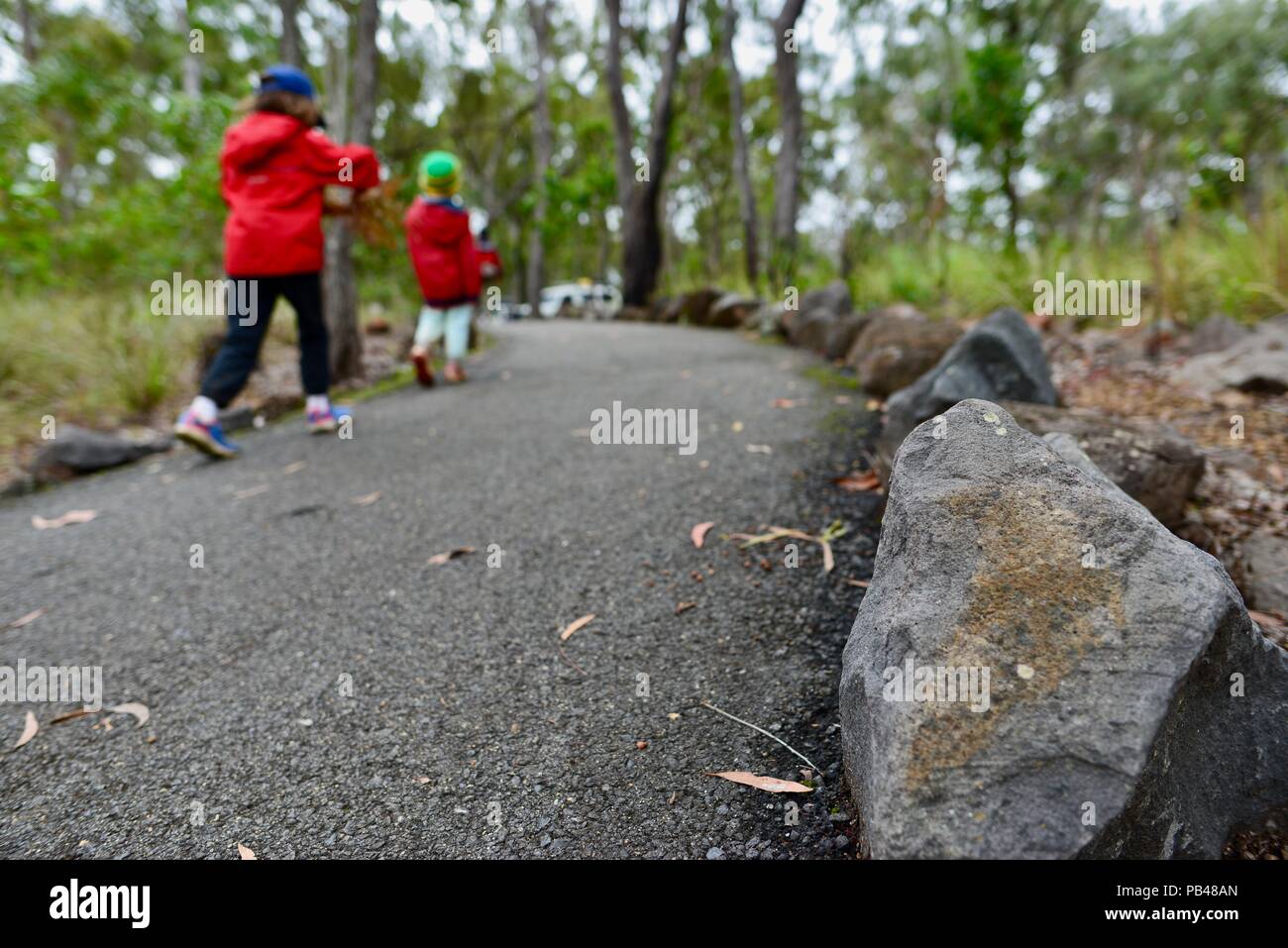 Children walking on the walking path to Big Millstream Falls