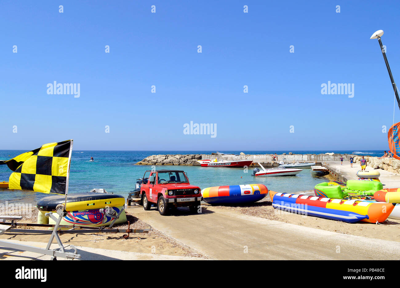 Inflatables for hire on Paphos Beach a tourist resort in Cyprus Stock Photo