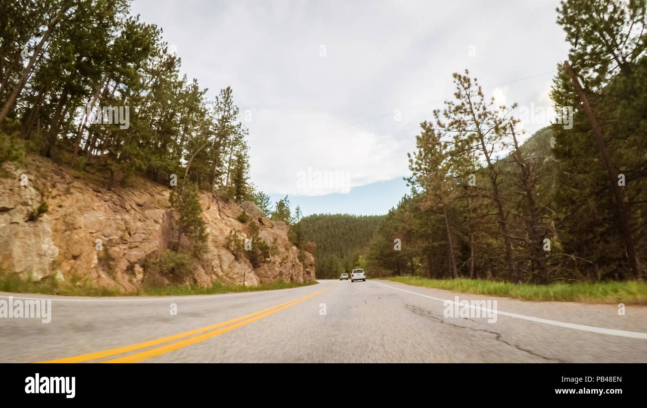 Driving on mountain road between Estes Park and Boulder in evening