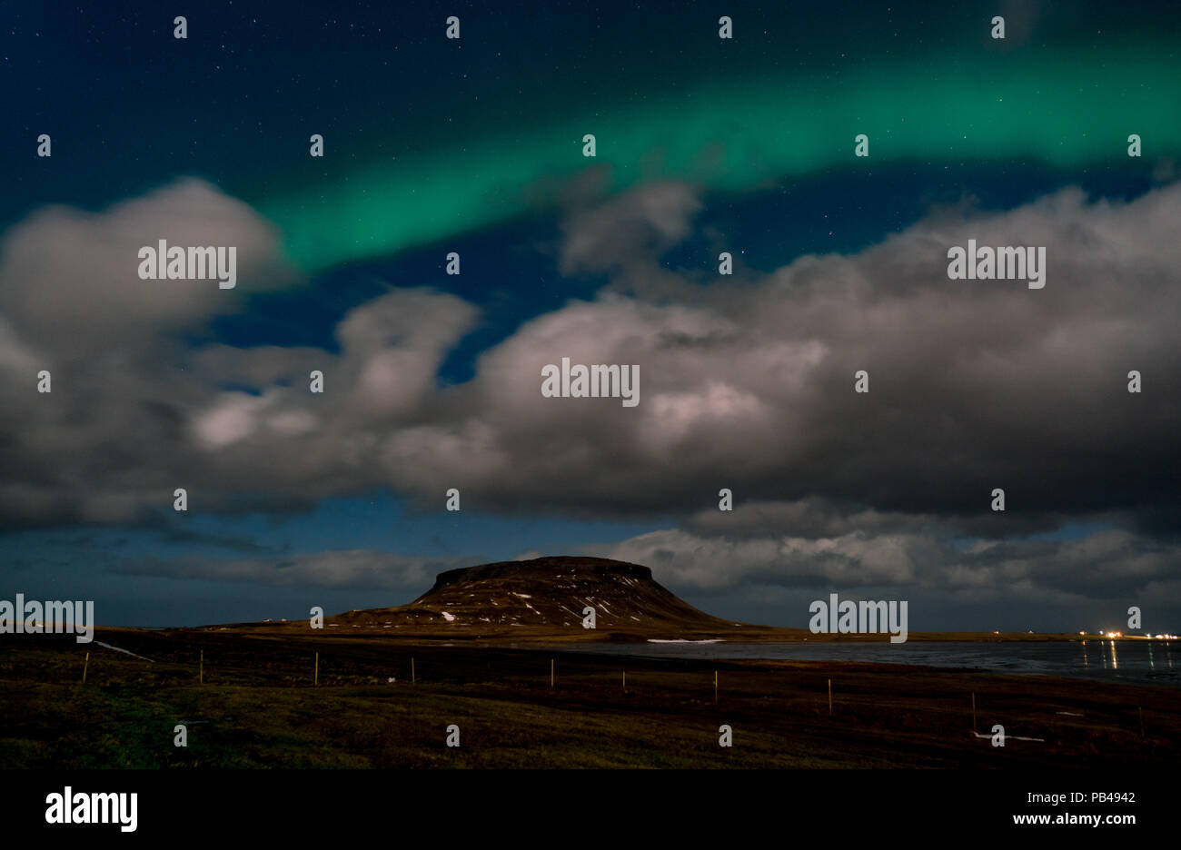 Northern lights aurora borealis appear over Mount Kirkjufell in Iceland