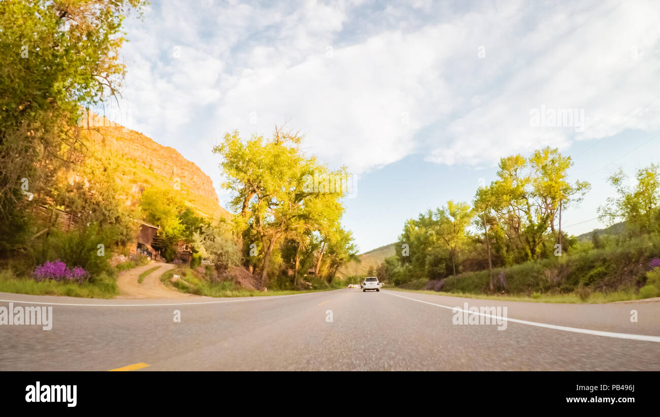 Driving on mountain road between Estes Park and Boulder in evening