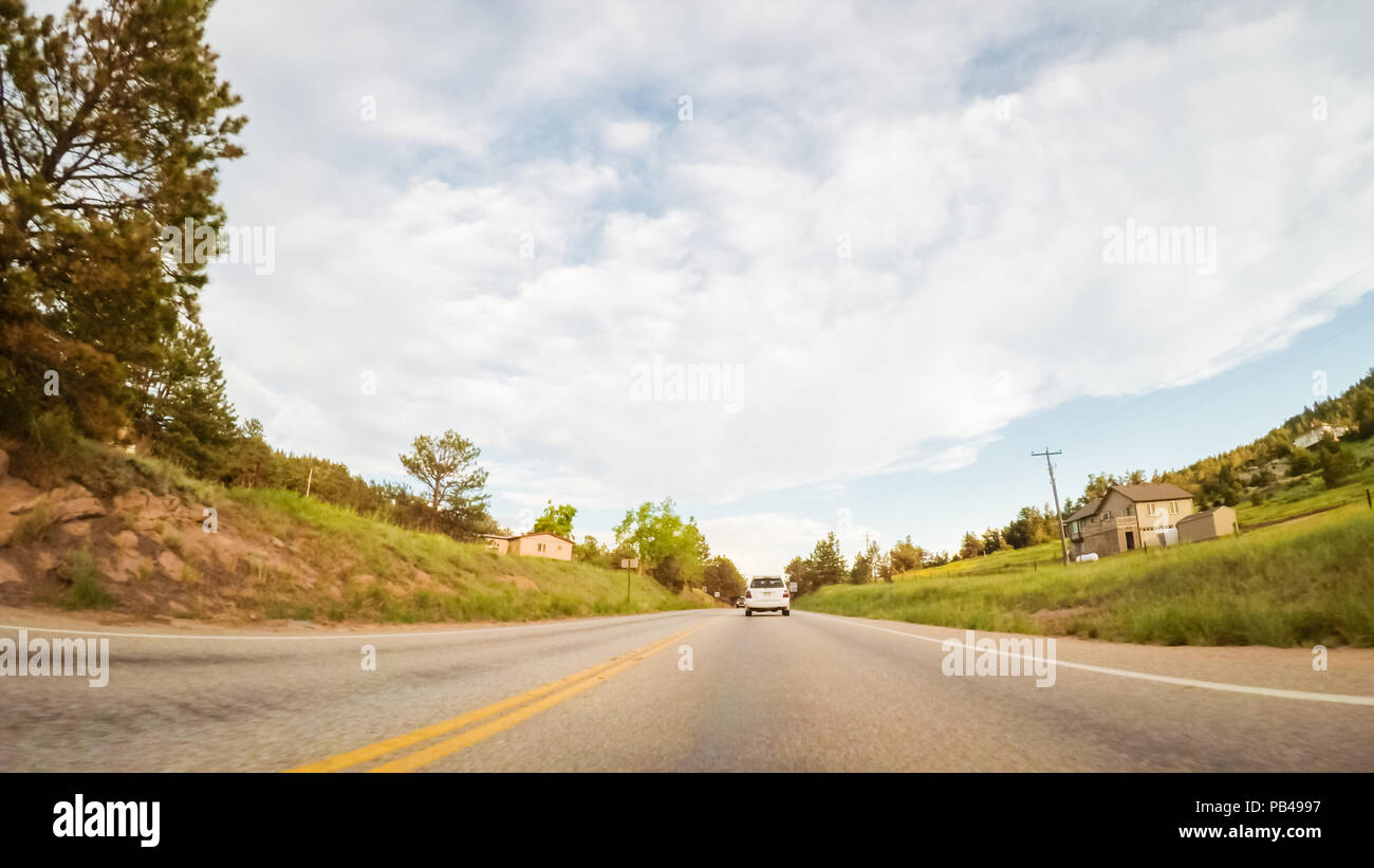 Driving on mountain road between Estes Park and Boulder in evening