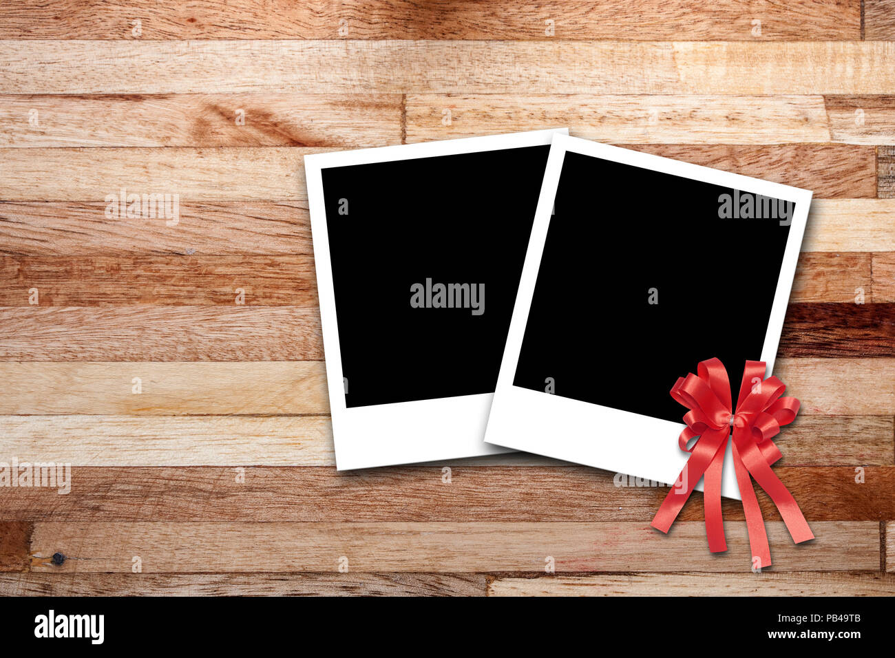 Blank photo frames on wood background Stock Photo