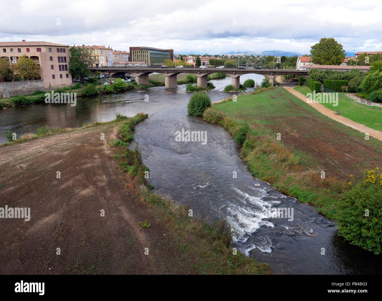 The River Aude running through the modern city of Carcassonne, southern France Stock Photo