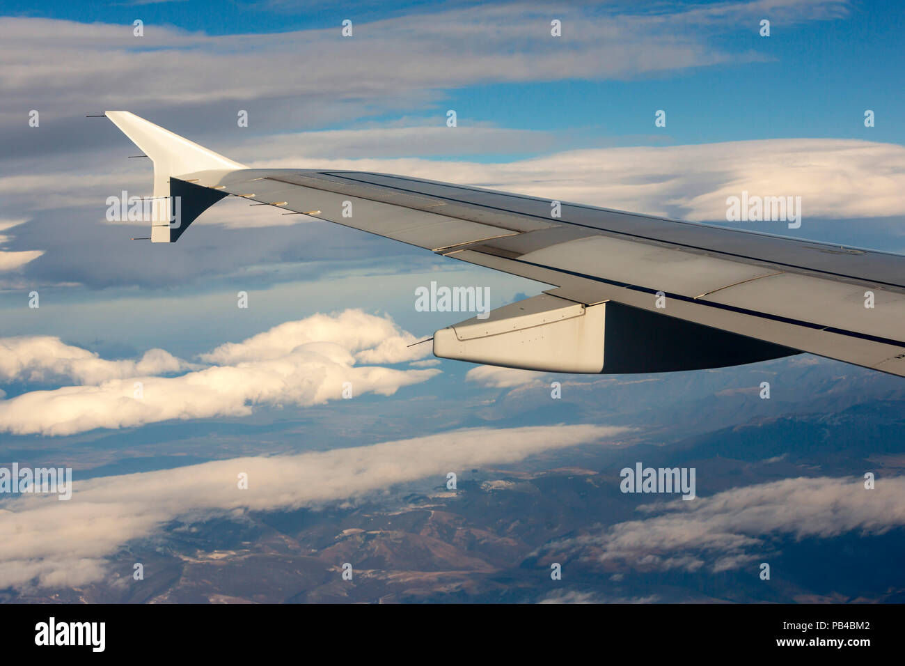 Airplane during flight with the sky and clouds on the background Stock ...