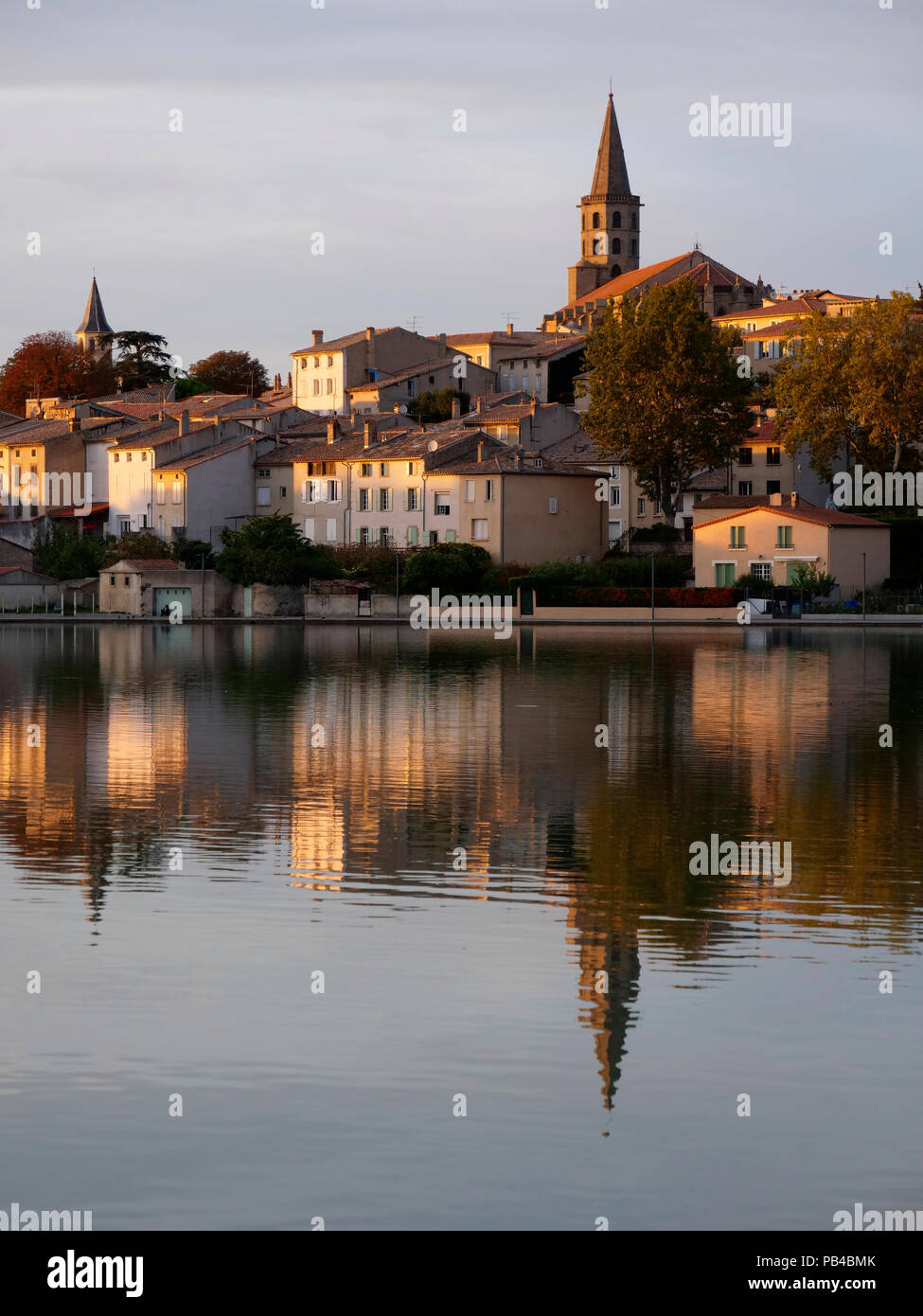 Evening sunset with canal boats moored in the Grand Bassin in Castelnaudary, Lauragais, France, on the Canal du Midi Stock Photo