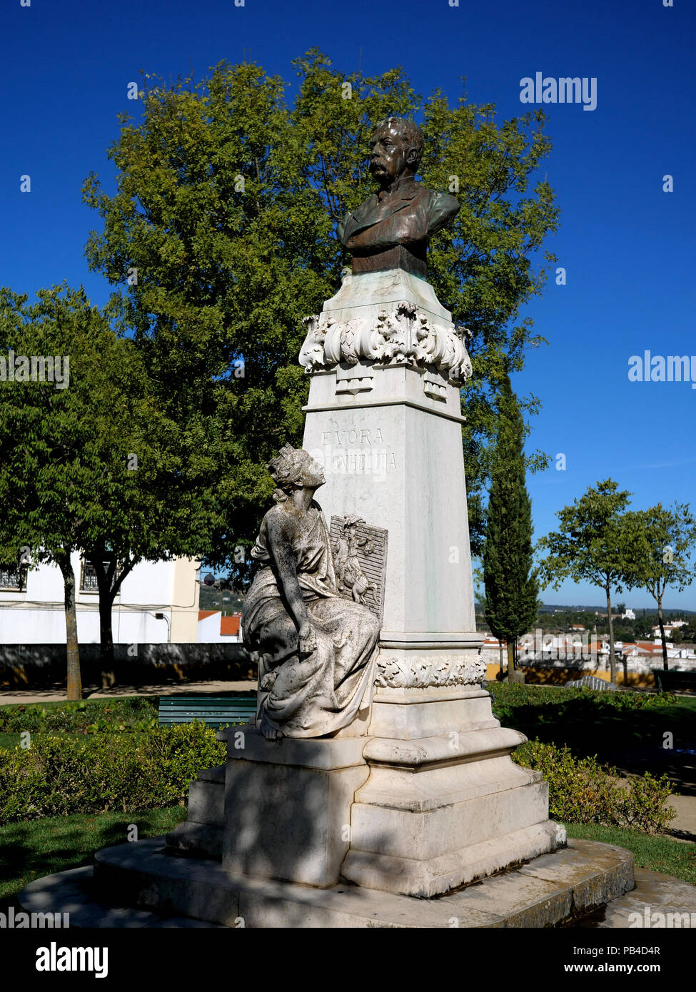 Statue of a maiden and bust of Dr Francisco Barahona, in the Diana Roman Temple Gardens in the Largo Conde de Vila Flor square, Evora, Portugal Stock Photo