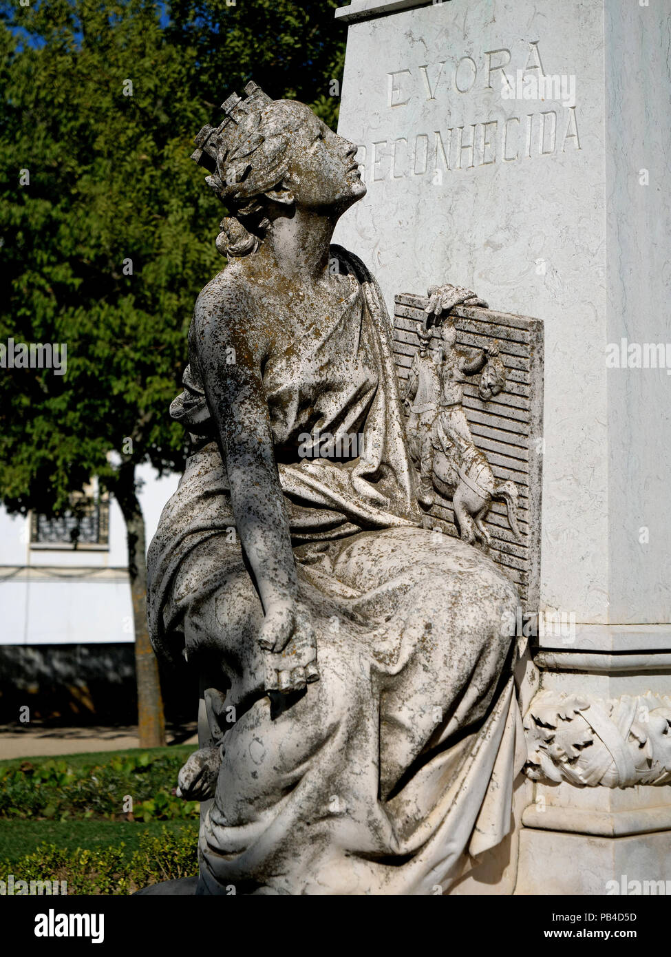 Statue of a maiden and bust of Dr Francisco Barahona, in the Diana Roman Temple Gardens in the Largo Conde de Vila Flor square, Evora, Portugal Stock Photo