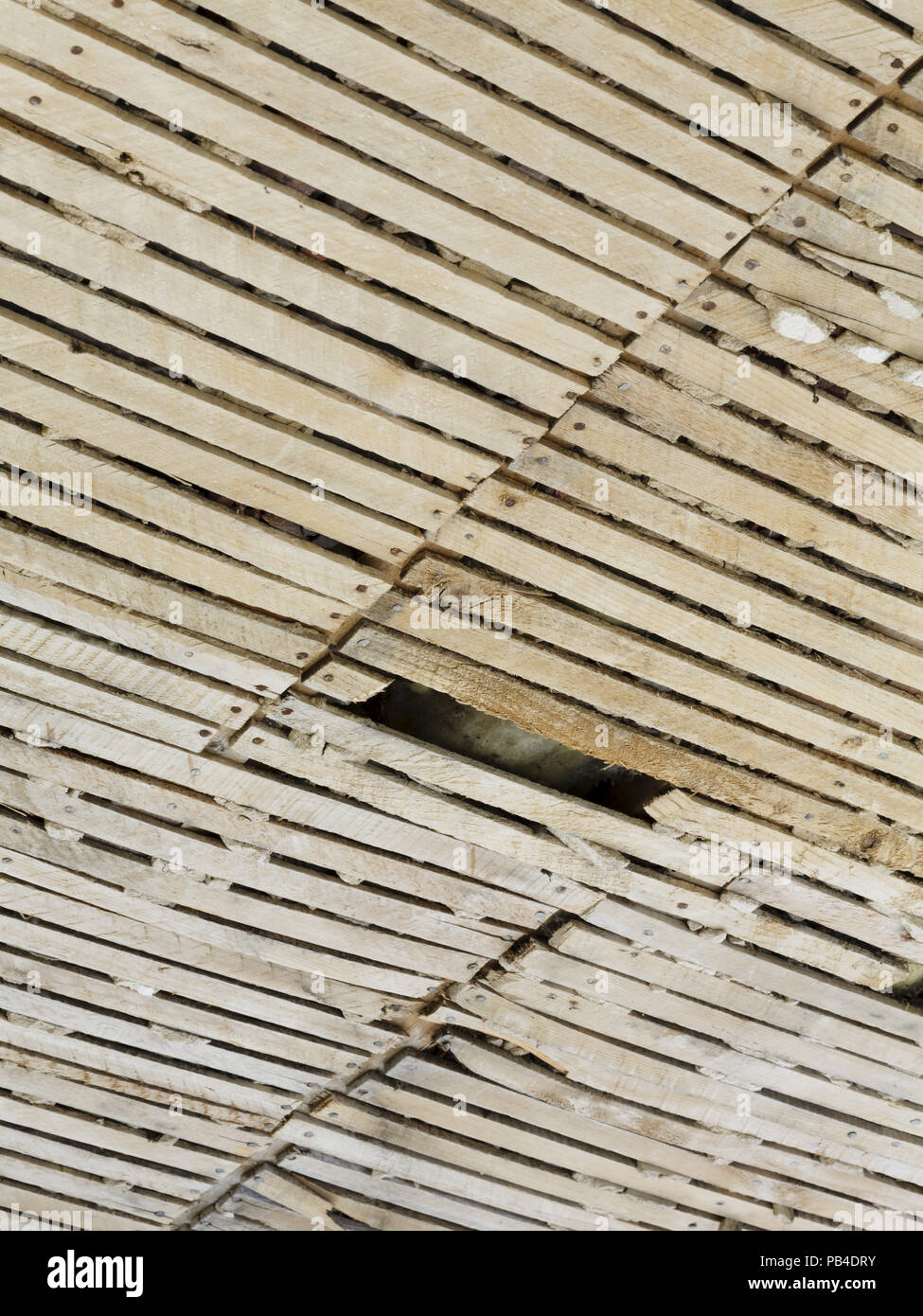 Old plaster and lath ceiling in need of repair Stock Photo