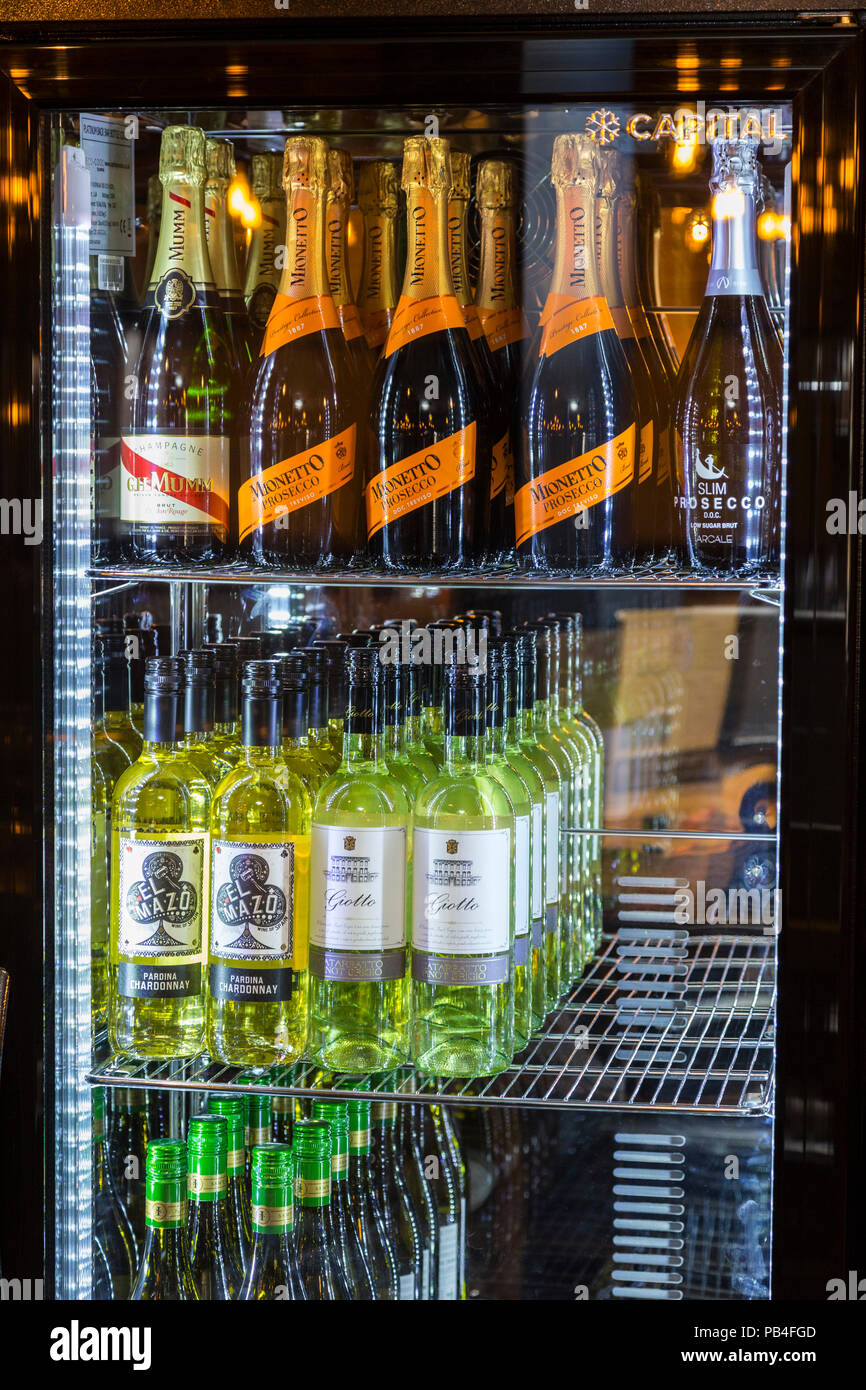Fridge in a pub with white wine, prosecco, champane Stock Photo - Alamy