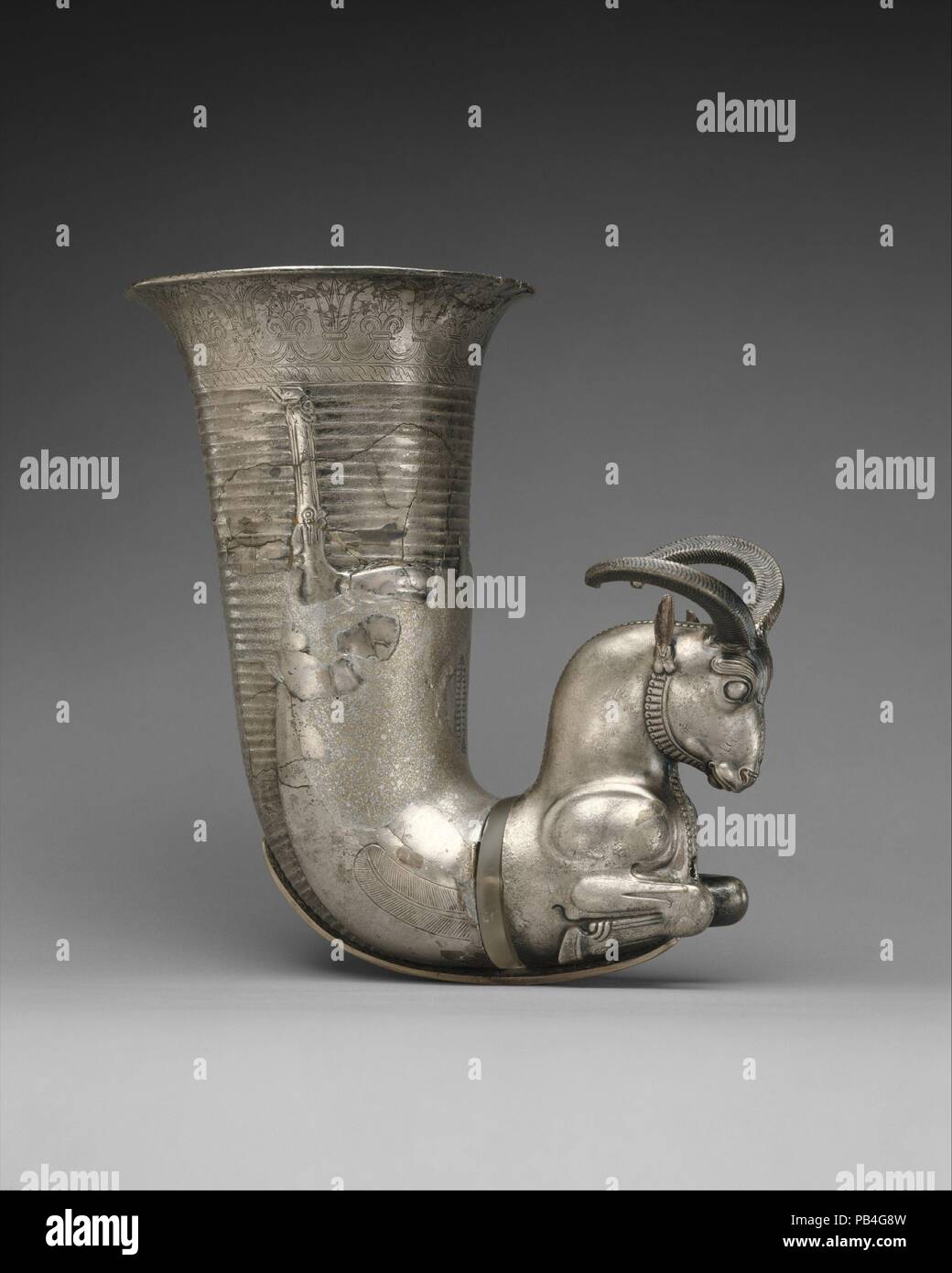 Rhyton terminating in the forepart of a ram. Culture: Achaemenid. Dimensions: 7.87 x 4.72 x 4.84 in. (19.99 x 11.99 x 12.29 cm). Date: ca. 5th century B.C.. Museum: Metropolitan Museum of Art, New York, USA. Stock Photo