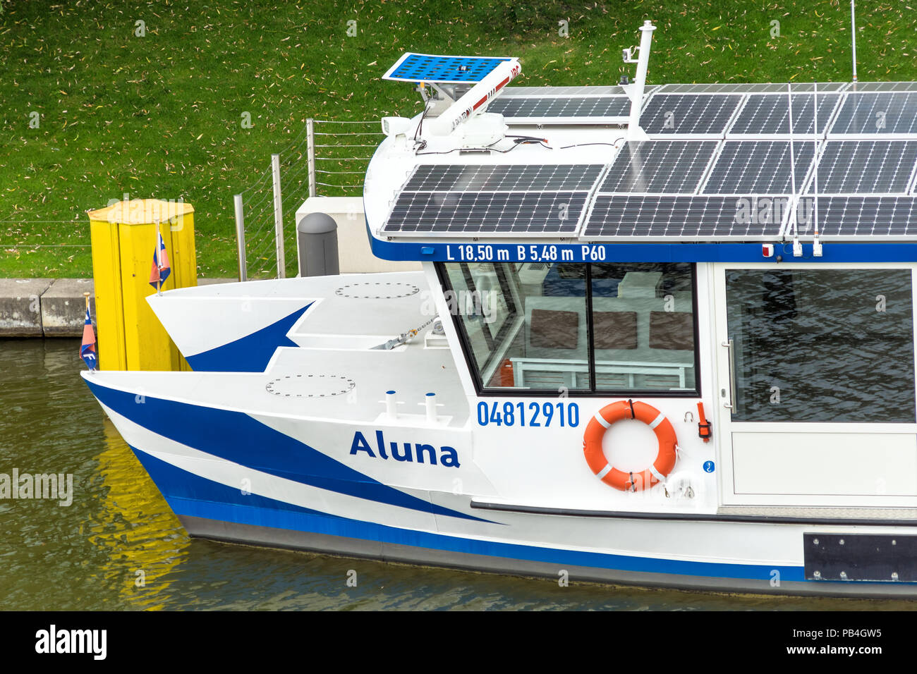 Wolfsburg, Lower-Saxony, Ger,any, July 21., 2018: Bow of the passenger ship Aluna at the pier on the Mittelland Canal in front of the Autostadt, roof  Stock Photo