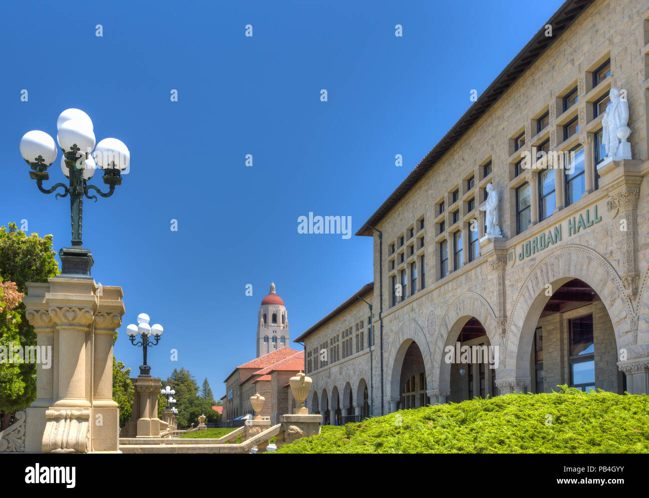 STANFORD, UNITED STATES - July 6: To the backdrop of Hoover Tower, historic Jordan Hall on the campus of Stanford University. July 6, 2013. Stock Photo