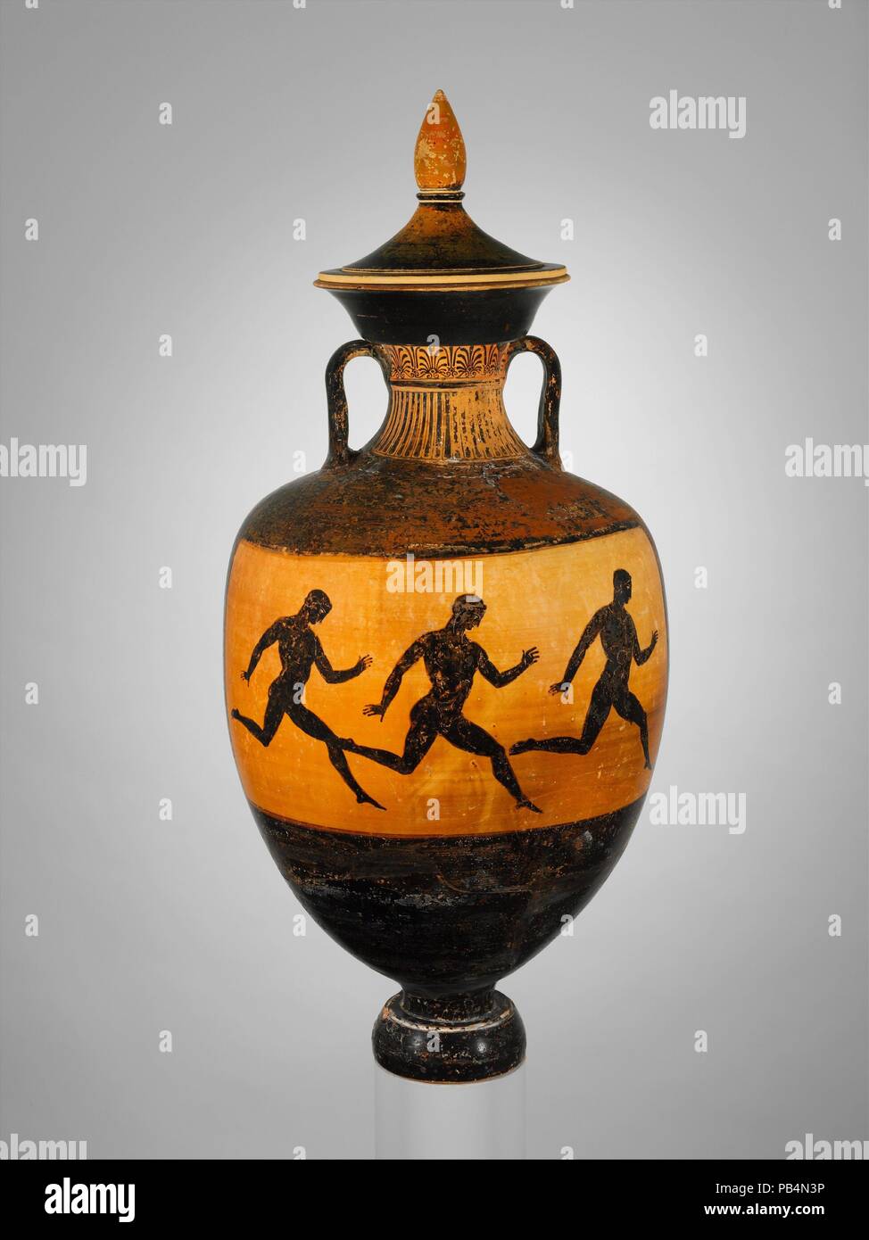Terracotta Panathenaic prize amphora. Culture: Greek, Attic. Dimensions: H. with lid  34 in. (86.3 cm); H. without lid  27 3/4 in. (70.5 cm); diameter of mouth  9 in. (22.9 cm); diameter of foot  5 1/2 in. (14 cm). Date: ca. 366/365 B.C..  Obverse, Athena  Reverse, footrace  Official prize amphorae in the Panathenaic games are always identified by an inscription. Beginning in the early fourth century B.C., an additional inscription gives the name of the archon, the civil magistrate during whose tenure the oil for the succeeding festival was harvested.  Because other sources provide the dates o Stock Photo