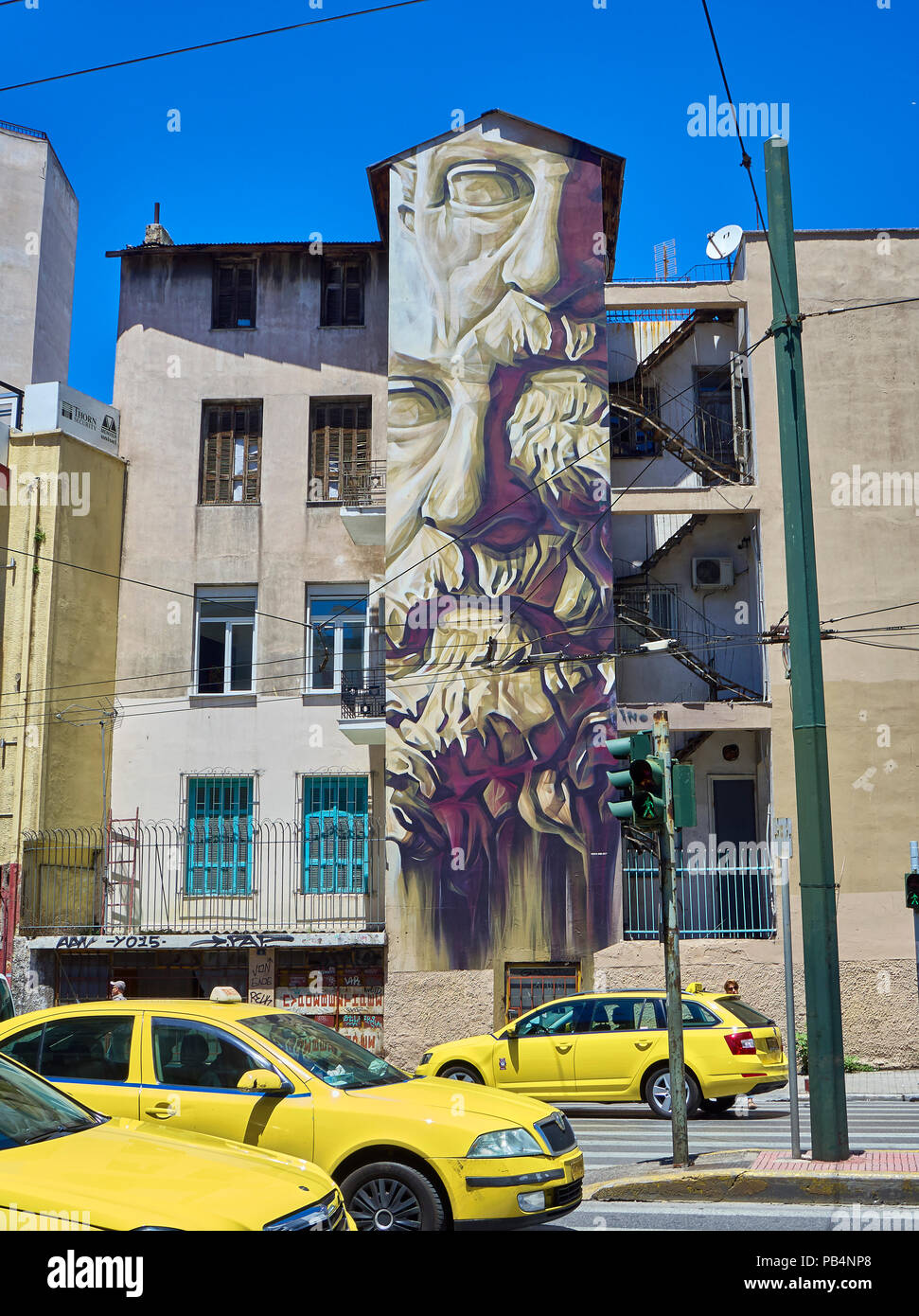 Athens, Greece - June 29, 2018. Graffiti of philosopher Solon, founder of Athenian democracy, by INO, a visual artist from Greece, in a building facad Stock Photo