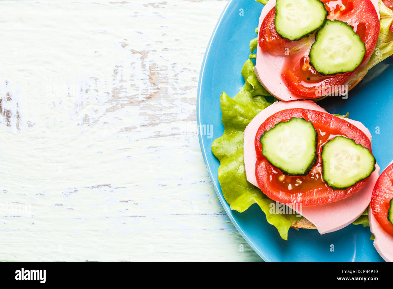 Bruschetta with salad, sausage, tomato and cucumber Stock Photo Alamy
