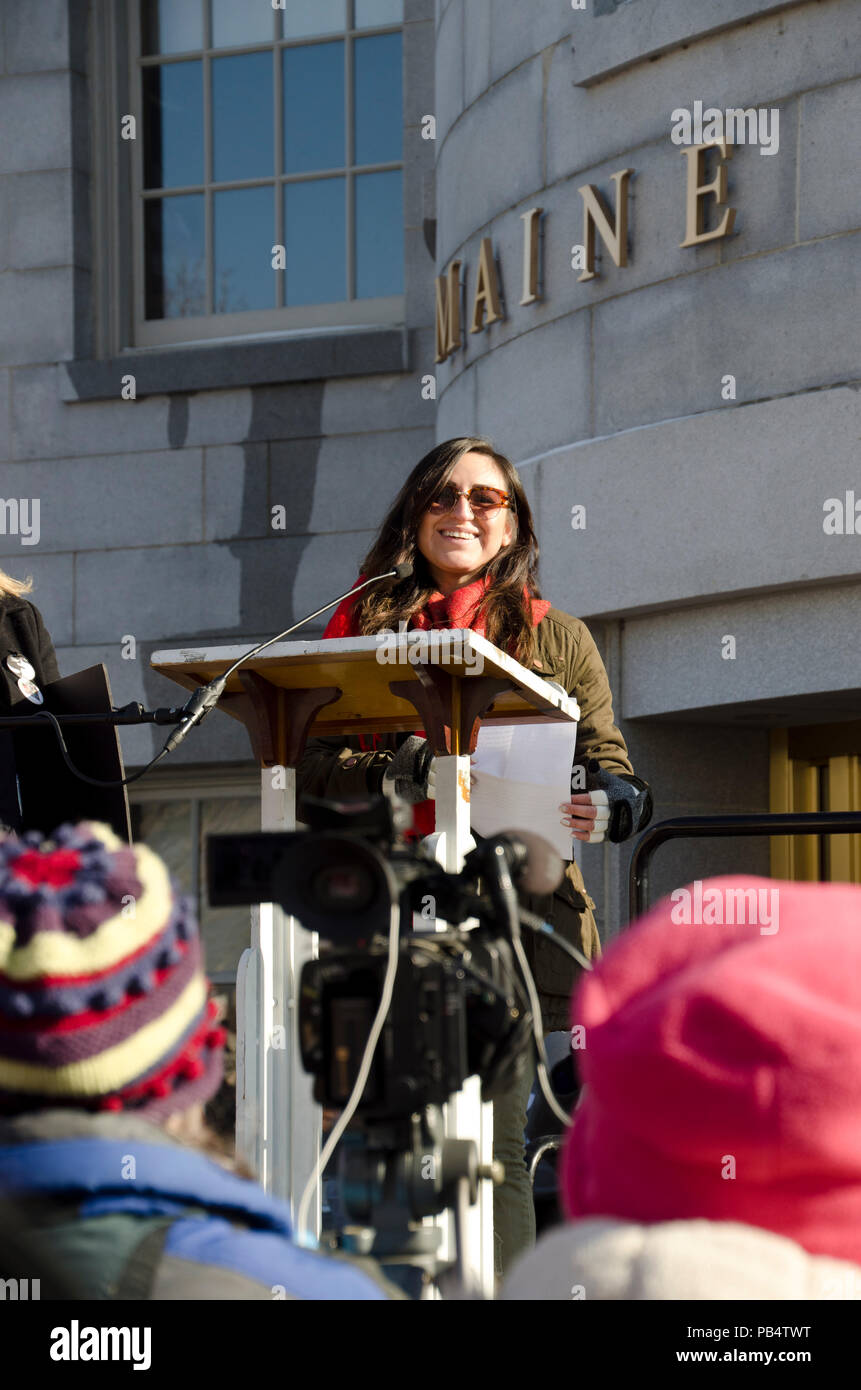 Young Hispanic woman speaking at Maine Women's March in Augusta ME, USA Stock Photo
