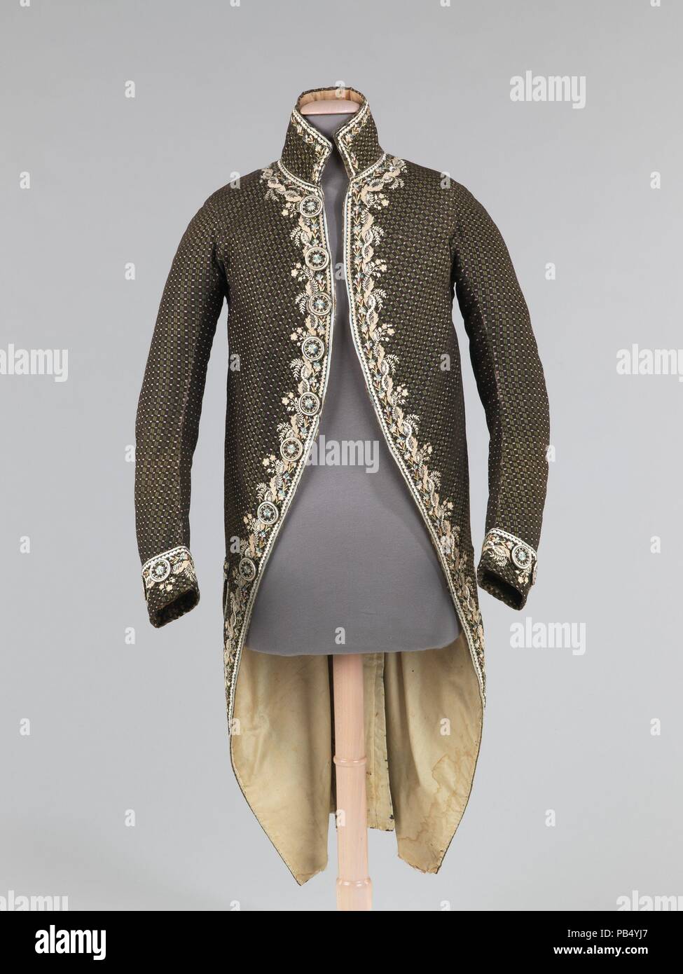 Costume of a nobleman at the court of King Louis XVI of France, late 18th  century. In wig, velvet coat, waistcoat and breeches, gold embroidery,  court sword, buckle shoes, bicorne hat. Seigneur
