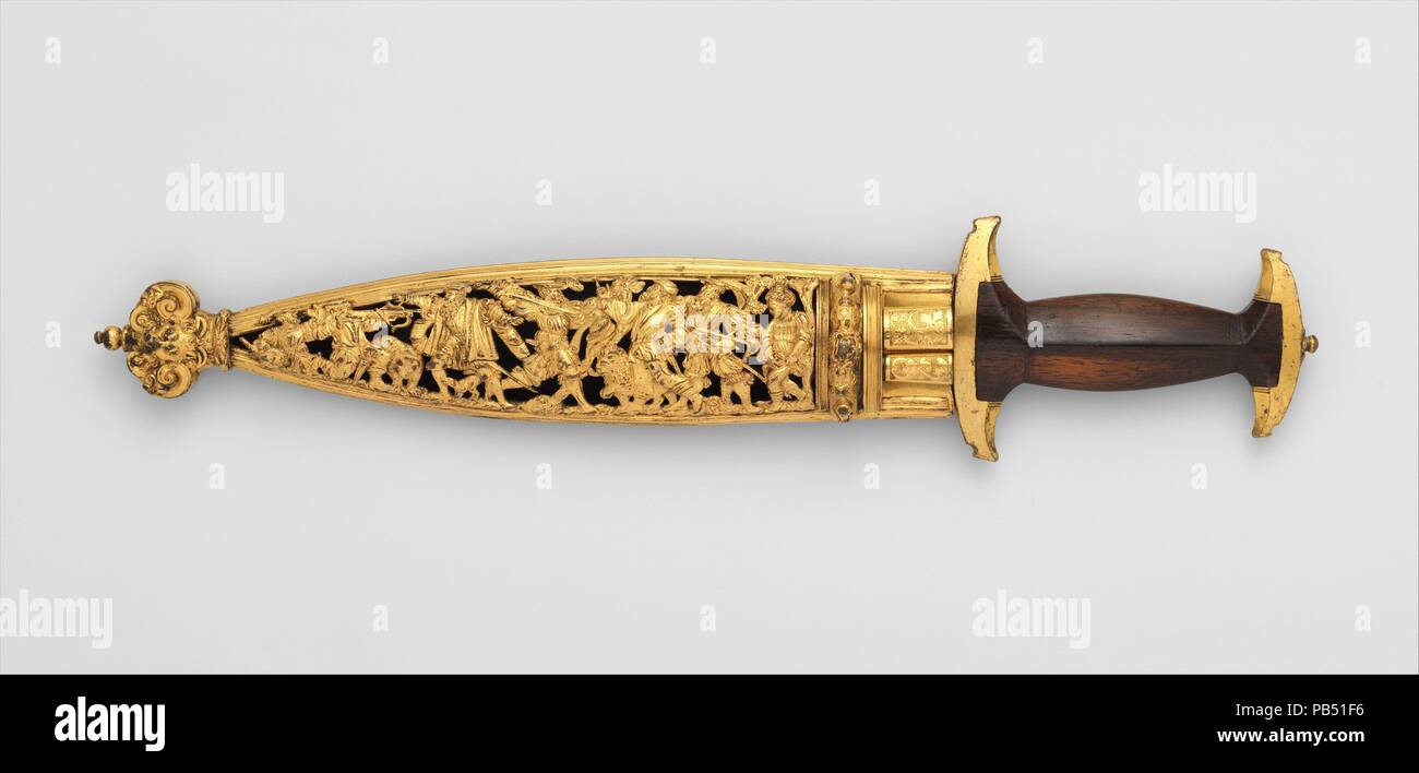 Swiss Dagger with Sheath, Bodkin, and By-Knife. Culture: Swiss. Dimensions: Dagger (04.3.130); L. with sheath 17 5/8 in. (44.8 cm); L. without sheath 15 3/4 in. (40 cm); W. 3 1/2 in. (8.9 cm); Wt. 1 lb. 1.5 oz. (496.1 g); Wt. of sheath 13.3 oz. (377 g); bodkin (04.3.131); L. 7 1/16 in. (17.9 cm); Wt. 0.8 oz. (22.7 g); knife (04.3.132); L. 8 1/16 in. (20.5 cm); W. 5/8 in. (1.6 cm); Wt. 1.1 oz. (31.2 g). Date: ca. 1570.  Daggers with I-shaped grips were known as baselards, after the city of Basel, and were considered a national arm of the Swiss. Splendidly decorated specimens such as this one, w Stock Photo