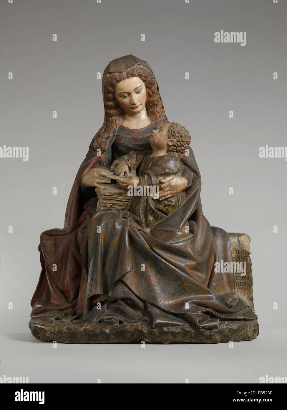 Virgin and Child. Artist: Attributed to Claus de Werve (Netherlandish, active in France, ca. 1380-1439, active Burgundy, 1396-ca. 1439). Culture: French. Dimensions: Overall: 53 3/8 x 41 1/8 x 27 in. (135.5 x 104.5 x 68.6 cm). Date: ca. 1415-17.  This monumental yet intimate image of the Virgin and Child was probably a gift of John the Fearless, Duke of Burgundy (d. 1419), or his wife, Margaret of Bavaria (d. 1424), to the convent they founded dedicated to the Franciscan order of Poor Clares at Poligny. As court sculptor to the Burgundian dukes in Dijon, the influential artist Claus de Werve,  Stock Photo