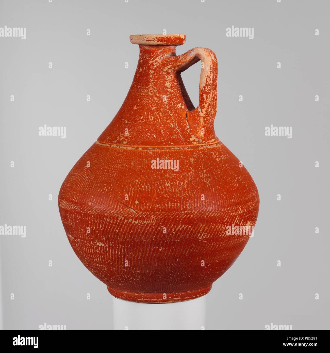 https://c8.alamy.com/comp/PB5281/terracotta-jug-culture-roman-dimensions-6-14in-158cm-date-2nd-half-of-the-1st-century-ad-red-glazed-jug-with-incised-body-and-one-handle-museum-metropolitan-museum-of-art-new-york-usa-PB5281.jpg