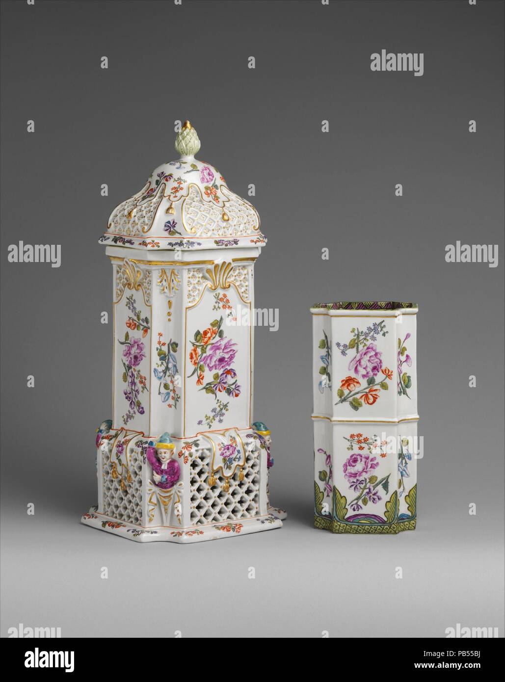 Food warmer with insert. Culture: Austrian, Vienna. Dimensions: Overall (confirmed): 15 9/16 x 6 5/16 x 6 11/16 in. (39.5 x 16 x 17 cm);  Insert: Overall (confirmed): 8 9/16 x 4 1/4 x 3 1/2 in. (21.7 x 10.8 x 8.9 cm);  Other (without cover): 11 in. (27.9cm). Factory: Vienna. Factory director: Du Paquier period (1718-1744). Date: ca. 1730-35.  This vessel was probably intended to be used in the intimate living quarters of a house, which, in the eighteenth century would have been far removed from the kitchen. The porcelain insert once held a metal liner where the food was placed. The heat source Stock Photo