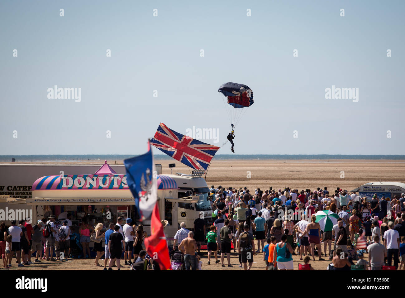 British Military personnel parachuting on to the beach during the 2018 Southport Airshow Stock Photo