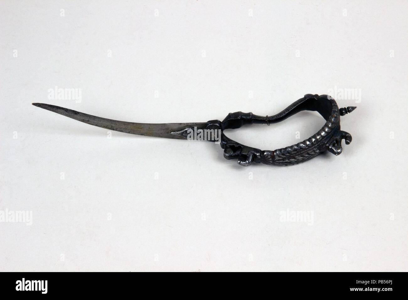Dagger (Bichuwa). Culture: South India. Dimensions: H. 10 in. (25.4 cm); W. 1 1/4 in. (3.2 cm); D. 2 3/8 in. (6 cm); Wt. 7.8 oz. (221.1 g). Date: 17th-18th century. Museum: Metropolitan Museum of Art, New York, USA. Stock Photo