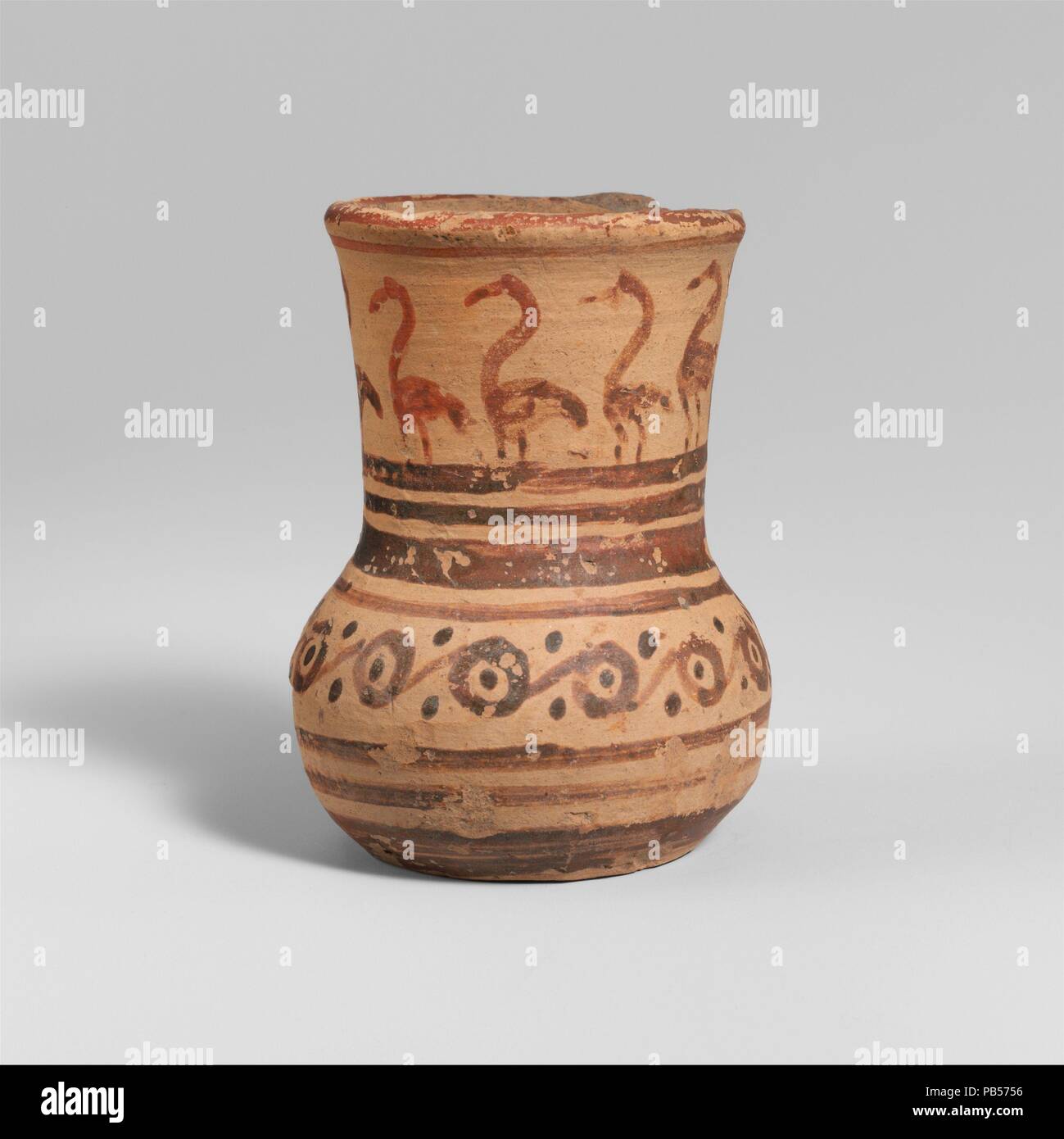 Terracotta tankard. Culture: Greek, Attic. Dimensions: H. 3 in. (7.6 cm). Date: late 8th-early 7th century B.C..  On the neck, waterbirds. Museum: Metropolitan Museum of Art, New York, USA. Stock Photo