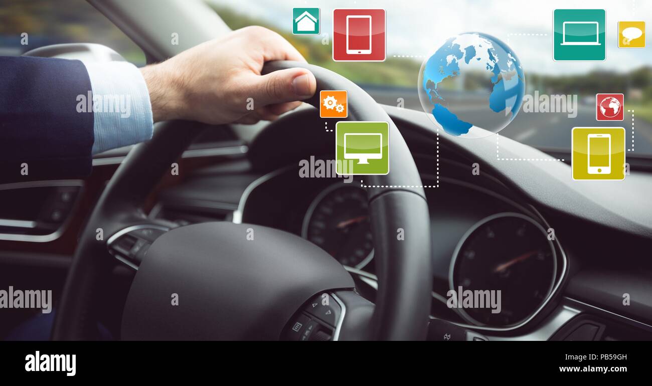 Man driving in car with heads up display interface Stock Photo - Alamy