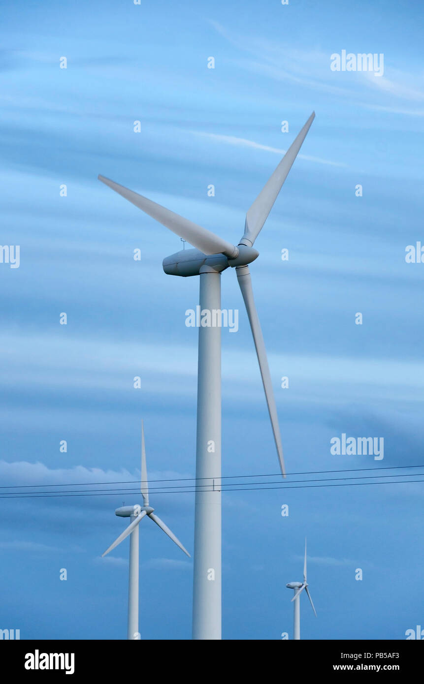 wind turbines before blue sky Stock Photo