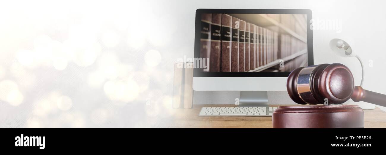 Gavel and computer with books of law and justice with transition Stock Photo