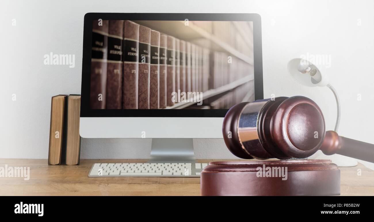 Gavel and computer with books of law and justice Stock Photo