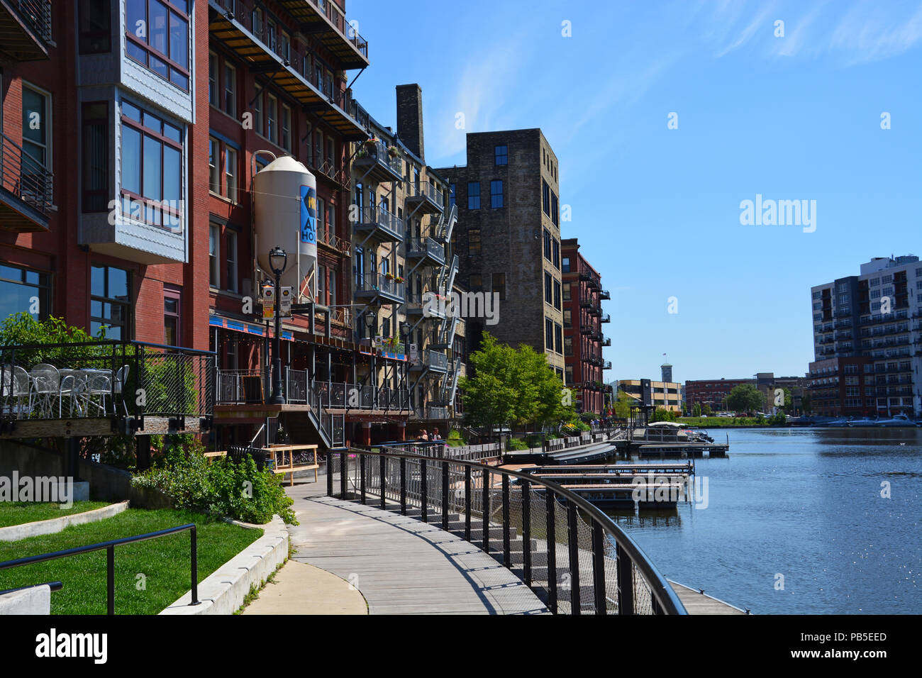 Milwaukee's Riverwalk passes old warehouses converted into living spaces in the Third Ward