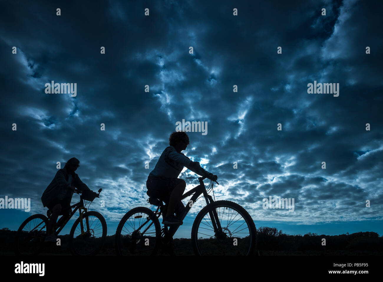 couple of rider in mountain bike come 