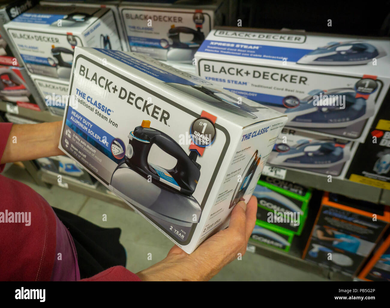 A shopper chooses a Black & Decker brand steam iron in a hardware store in  New York on Thursday, July 19, 2018. Stanley Black & Decker is scheduled to  report second-quarter earnings