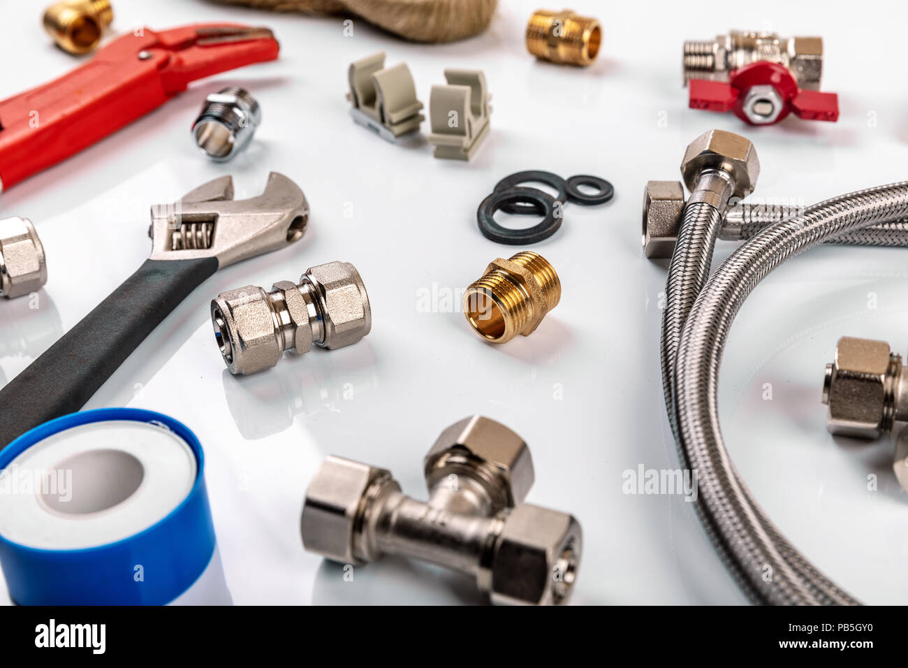 plumber tools and equipment on white background Stock Photo