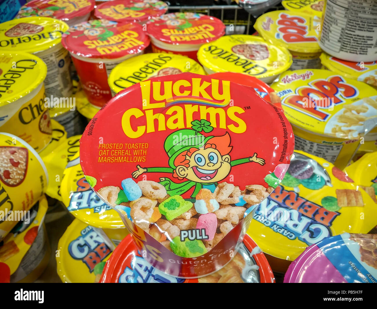Single-serving containers of General Mills' Lucky Charms amongst other breakfast cereals in a supermarket in New York on Tuesday, July 24, 2018. (Â© Richard B. Levine) Stock Photo