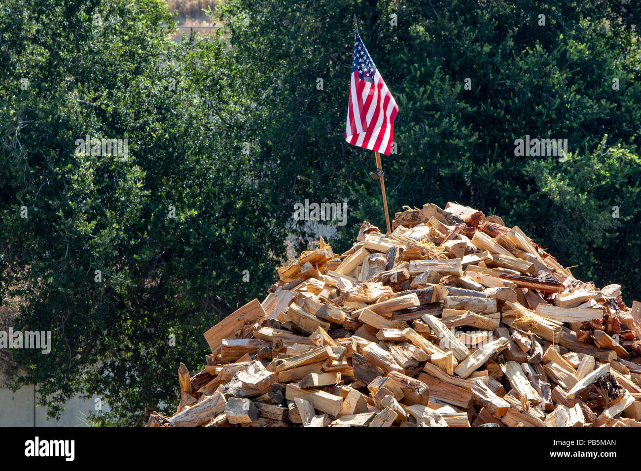 An American Flag on top of a large stack of firewood Stock Photo - Alamy