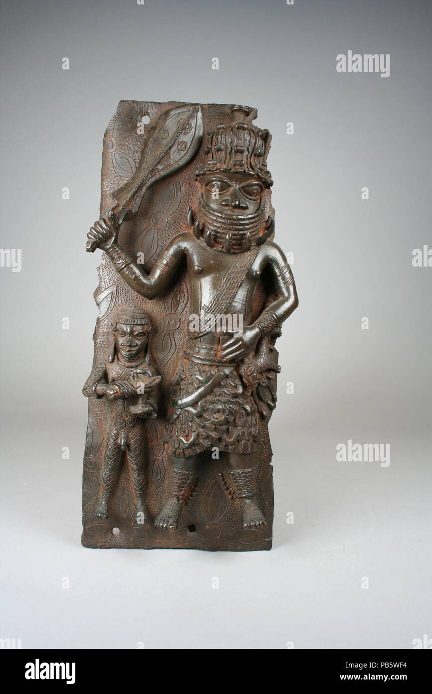 Plaque: Iyase with Sword and Attendant. Culture: Edo peoples. Dimensions: H. 15 3/4 x W. 7 1/4 x  D. 2 1/2 in. (40 x 18.4 x 6.4 cm). Date: 1550-1680. Museum: Metropolitan Museum of Art, New York, USA. Stock Photo
