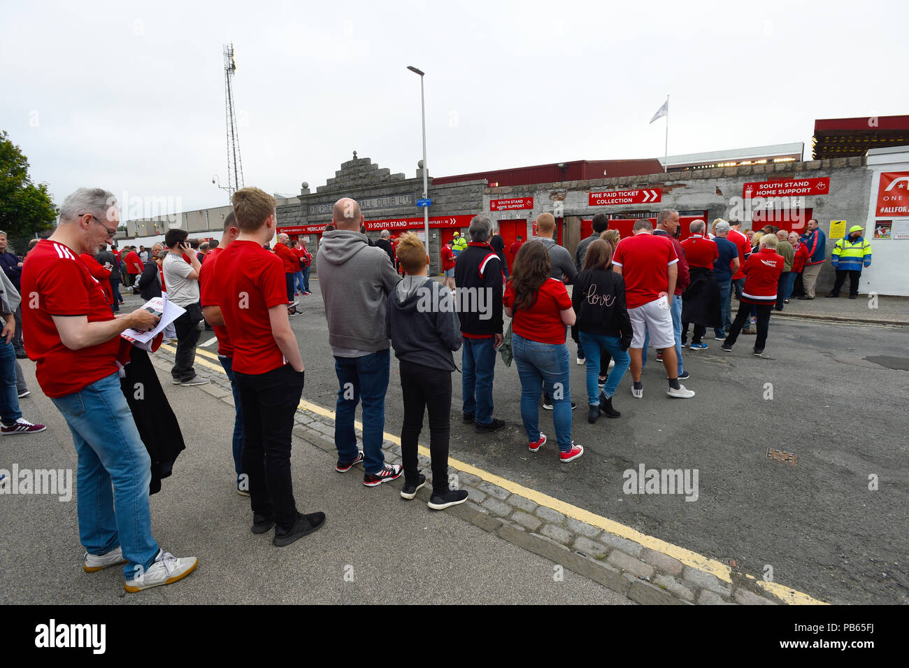 Aberdeen fans queuing outside the ground ahead of the UEFA Europa League second qualifying round, first leg match at Pittodrie Stadium, Aberdeen. Stock Photo