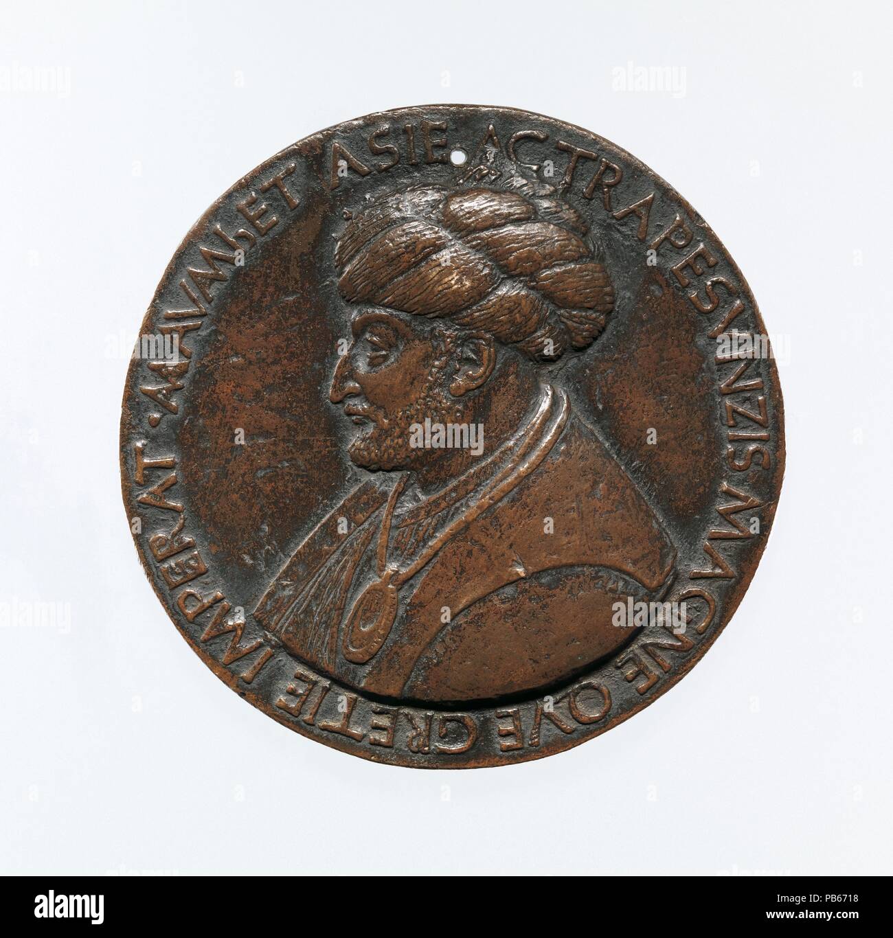 Portrait medal of Sultan Mehmed II (obverse); a Triumphal Chariot (reverse). Artist: Bertoldo di Giovanni (Italian, born Florence (?) ca. 1430-40, died 1491 Poggio a Caiano). Dimensions: Diam. 9.4 cm, wt. 321.66 g.. Date: model 1480 (old aftercast).  Bertoldo based this likeness on a medal by the Venetian artist Gentile Bellini, who had also painted the Ottoman sultan's portrait. Mehmed favored Italian medalists, perceiving their art form as a way to emphasize his rightful lineage among the emperors of Byzantium and ancient Rome. This medal, Bertoldo's largest and only signed example, was a gi Stock Photo