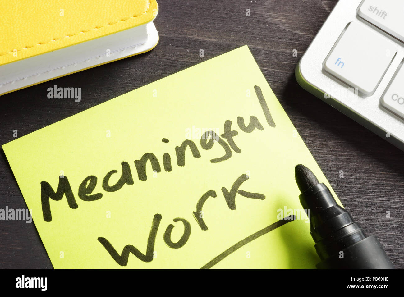 Meaningful Work written on a memo stick. Stock Photo